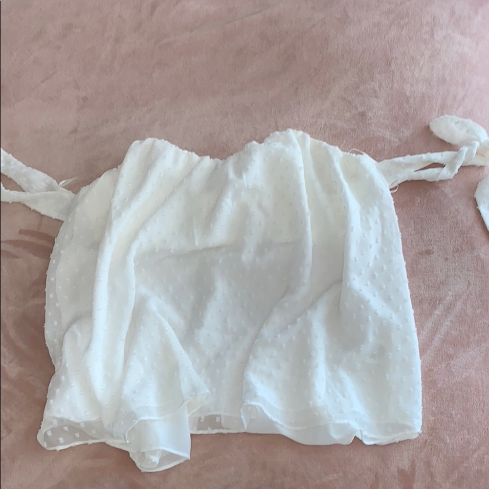 Francesca’s flowy sheer off the shoulder top